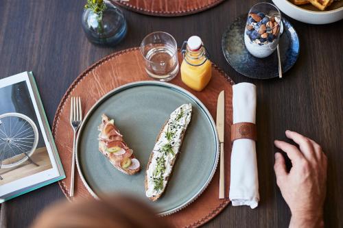 a table with a plate of food on a table at SILENA, your soulful hotel - adults only in Valles