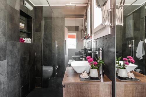 a bathroom with a sink and a toilet at Charming La Latina Home in Madrid