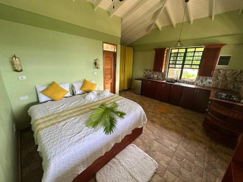 a bedroom with a large bed in a room at Mabrika Resort Dominica in Guillet