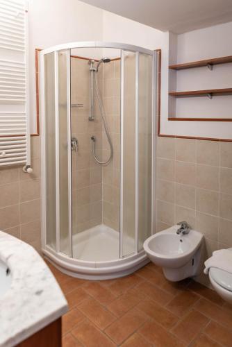 a bathroom with a shower and a toilet and a sink at By the Lake 29 - Menaggio by LoveComo in Menaggio