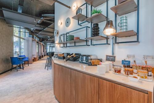 a lobby of a store with a counter at Appart'City Collection Paris Gare de Lyon in Paris