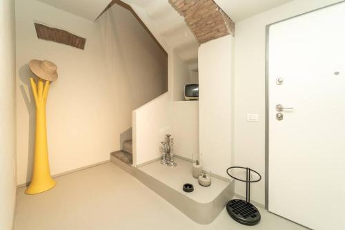 a white bathroom with a shower and a sink at Appartamento moderno a 2 minuti dal duomo di Como in Como