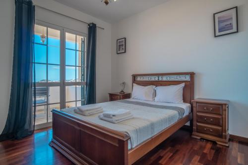 Säng eller sängar i ett rum på Vila Boa Nova