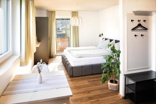 Postel nebo postele na pokoji v ubytování Moosaik Appartements