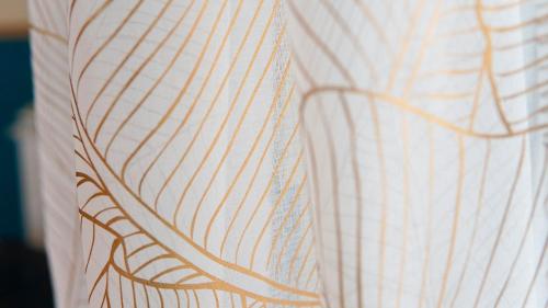 a close up of a white shirt with stripes at Lighthouse Ladispoli al centro in Ladispoli