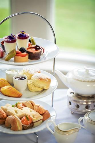 two tiered plates of pastries and a cup of tea at Lough Eske Castle in Donegal