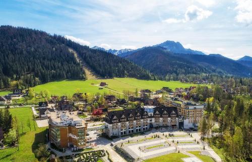 an aerial view of a large building in the mountains at Grand Nosalowy Dwór in Zakopane