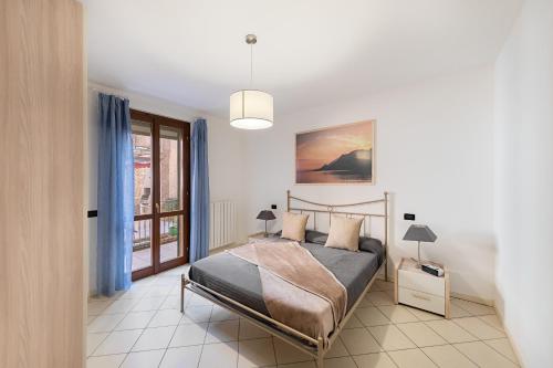 En eller flere senge i et værelse på Le Terrazze PT36 by Wonderful Italy