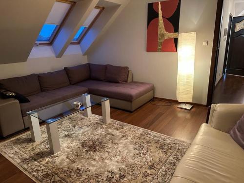 a living room with a couch and a table at Family house in Wieliczka