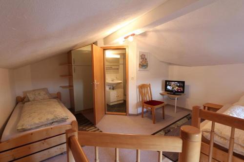 Cama o camas de una habitación en Hotel Alpina