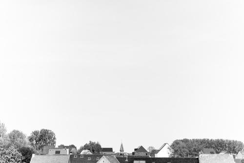 a black and white photo of a city with buildings at Poëziehotel Surplace - 15 min van Pairi Daiza & industriezone Ghislenghien in Bever