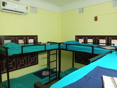 a group of bunk beds in a room at Sili hostel in Siliguri