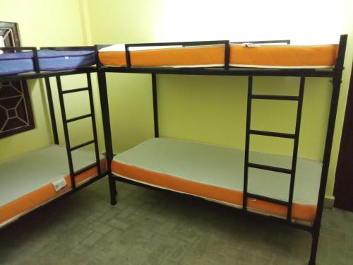 two bunk beds are sitting in a room at Sili hostel in Siliguri