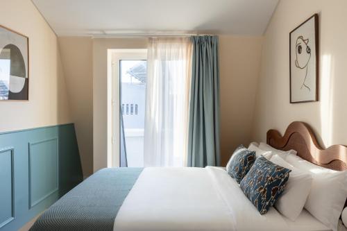 Giường trong phòng chung tại Haws Lisboa