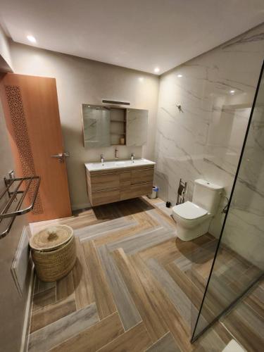 a bathroom with a toilet and a sink and a shower at Domaine K Marrakech in Marrakesh
