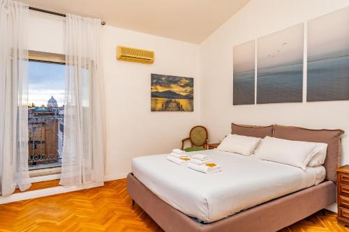 a bedroom with a large bed and a window at Rooftop 2 BDR Apartment with 360-Degree Views in Rome