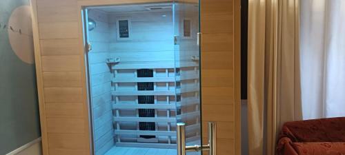 a glass door to a wine cellar in a room at Le Plejadi in Castellammare del Golfo