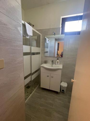 a bathroom with a sink and a mirror at AL MANDORLO Casa Vacanze in Viterbo