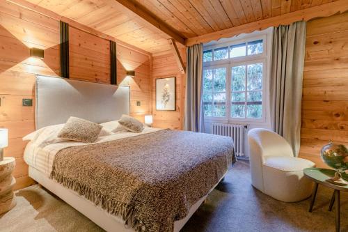 Ένα ή περισσότερα κρεβάτια σε δωμάτιο στο Le Chalet d'Antoine - Centre de Megève