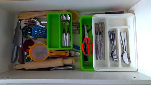 a drawer filled with lots of utensils at Urban Haven 3BR Apartment in Nairobi