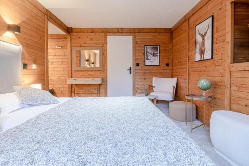 Ένα ή περισσότερα κρεβάτια σε δωμάτιο στο Le Chalet d'Antoine - Centre de Megève