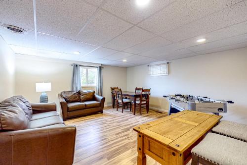a living room with a couch and a table at Falling Leaf Hideaway in Canandaigua