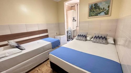 Ένα ή περισσότερα κρεβάτια σε δωμάτιο στο Pousada São Luiz