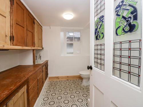 a bathroom with a toilet and a door at Sunnycote in Carnforth