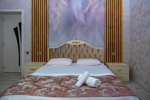 Postel nebo postele na pokoji v ubytování Qafqaz Panoramic Mountain Chalet