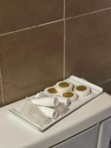 a white plate with cookies on top of a counter at Casita de Piedra 11 in Trinidad