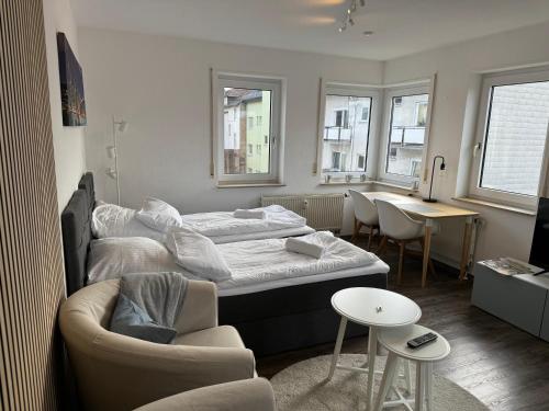 Postel nebo postele na pokoji v ubytování Hübsche Wohnung mit Balkon für 1-2 Personen - Einzelbetten