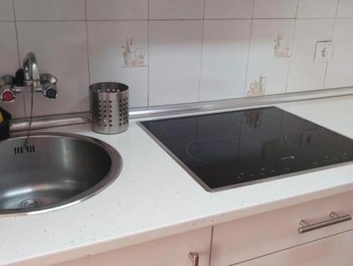 a kitchen counter with a sink and a sink at Sunflower Playa Lisa in Santa Pola