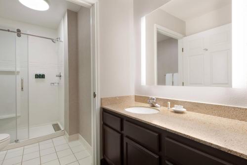 a bathroom with a sink and a shower at Residence Inn San Jose South/Morgan Hill in Morgan Hill