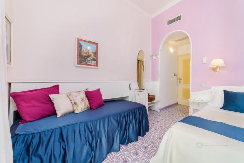 Ένα ή περισσότερα κρεβάτια σε δωμάτιο στο Hotel La Bussola