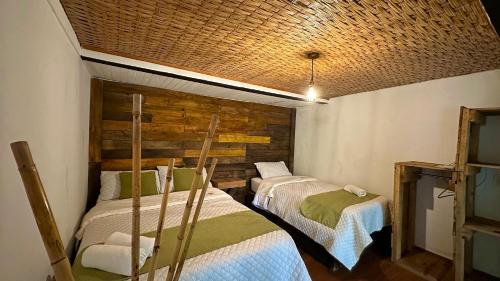 Una cama o camas en una habitación de Hotel Campestre mirador CaloPala