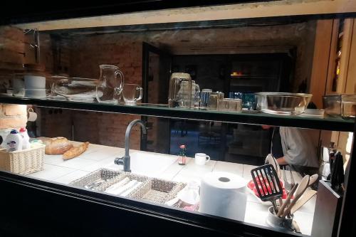 a kitchen with a counter top with a sink at Depo Loco ( Banícke depo) in Špania Dolina