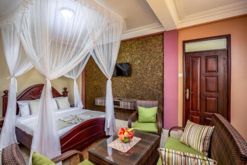 Postel nebo postele na pokoji v ubytování Keba Xpress Hotel - Entebbe