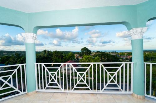 a view from the balcony of a house at Belle Air Seaview- Entire Home (5 Bdrm 5Bath) in Runaway Bay