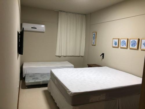 Ένα ή περισσότερα κρεβάτια σε δωμάτιο στο Lindo Apartamento com Vista Mar.