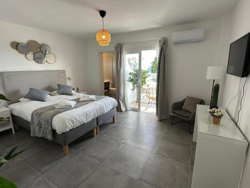 En eller flere senge i et værelse på Casa Volcano