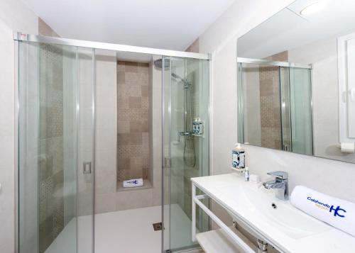 a bathroom with a shower and a sink at HC Calahonda Beach Nerja in Nerja