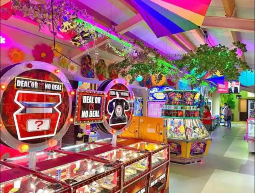 a game room with many games and a arcade at Seal Bay Resort in Selsey