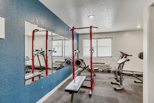 a gym with two tread machines and a mirror at Motel 6 Ogden, UT- Downtown in Ogden