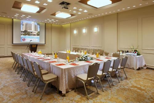 a conference room with a long table and chairs at Ramada Jerusalem Hotel in Jerusalem