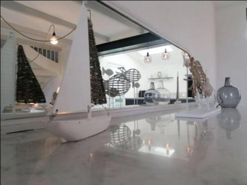 a room with christmas trees and vases on the floor at Ty Plou in Ploubazlanec