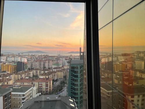 a view of a city from a window at studio unit whit pool and gym in Istanbul