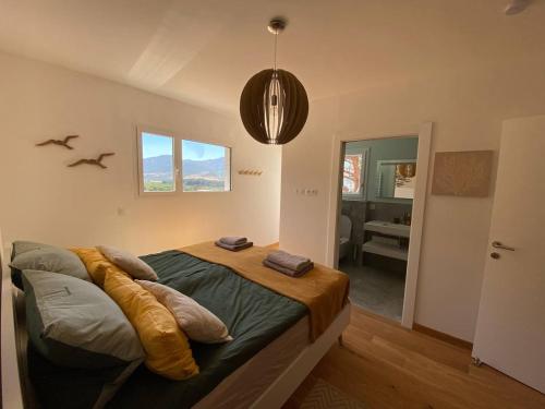 a bedroom with a bed and a bathroom at Fiore di Machja - Moncale in Moncale