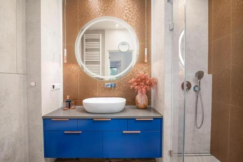 a bathroom with a sink and a mirror at Apartamenty u Edyty in Jastrzębia Góra