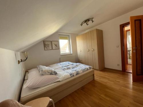 a bedroom with a bed in a attic at Machy Liptov in Liptovská Kokava