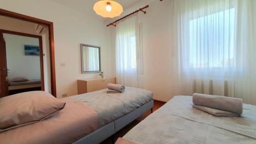 Postel nebo postele na pokoji v ubytování NIKO casa - 3 bedroom townhouse